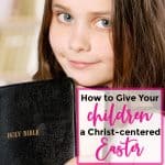 child holding bible while celebrating a Christ-centered Easter
