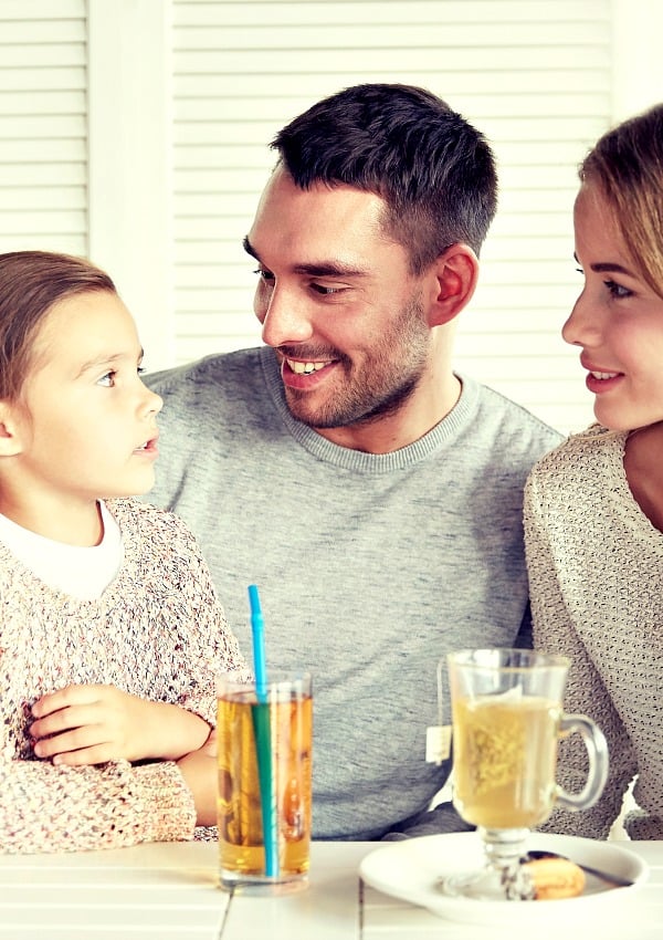 mom and dad using conversation games for kids to connect with their daughter