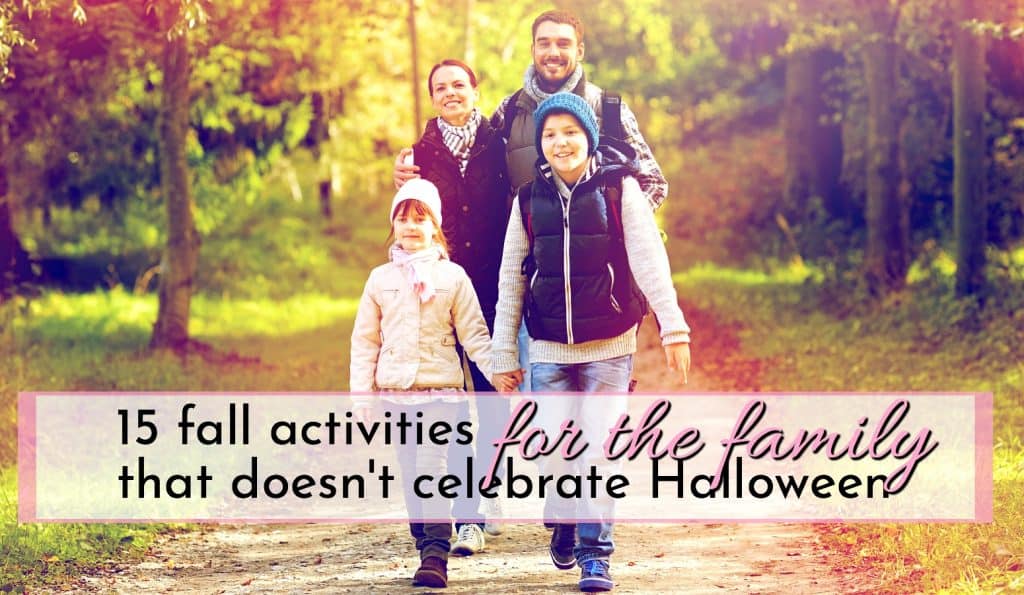 family of 4 walking hand in hand in the fall looking for fall activities for the family who doesn’t celebrate Halloween