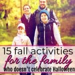 happy family playing in leaves and wheel barrell with fall activities for the family who doesn't celebrate Halloween