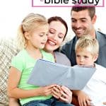 mom dad and two children doing a family bible study