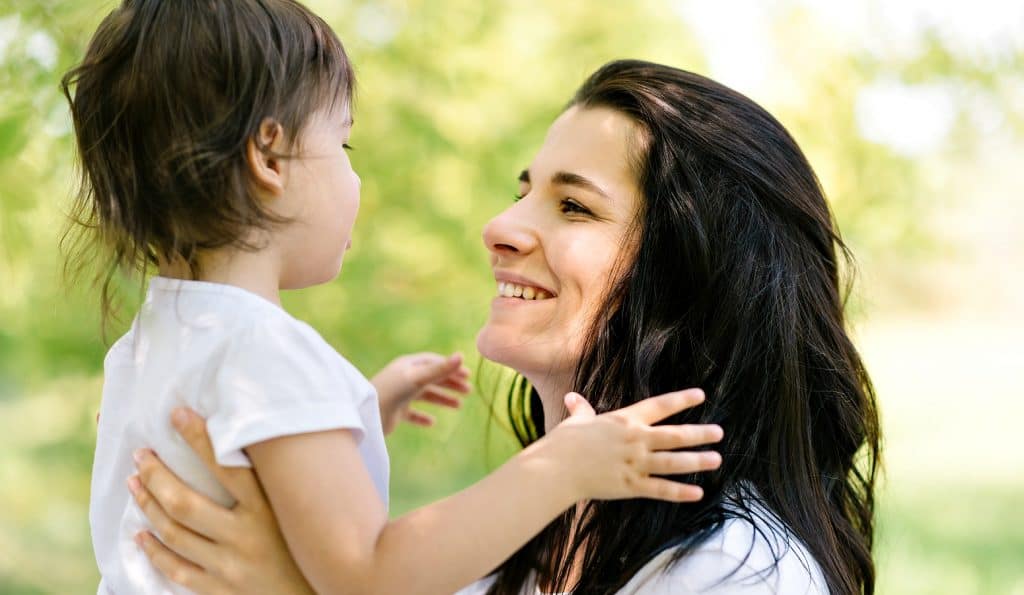 mom with child displaying good parenting skills by listening and engaging