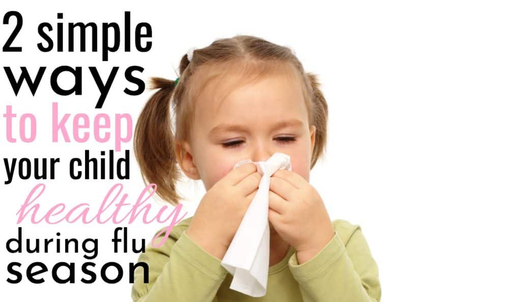 little girl blowing her nose after not keeping healthy during flu season