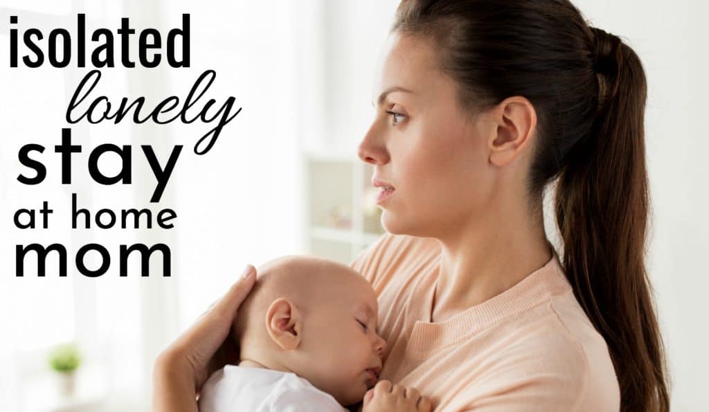 isolated lonely depressed stay at home mom holding baby while staring out the window