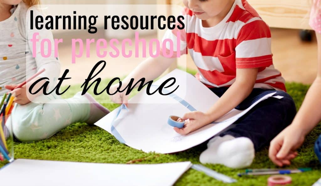 little boy on the floor using learning resources while doing preschool at home