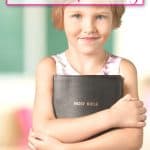 little girl holding bible to read scriptures on parenting